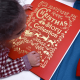 Child Holding Personalized Christmas Storybook Collection