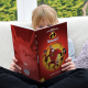 Child holding Personalized Incredibles 2 book